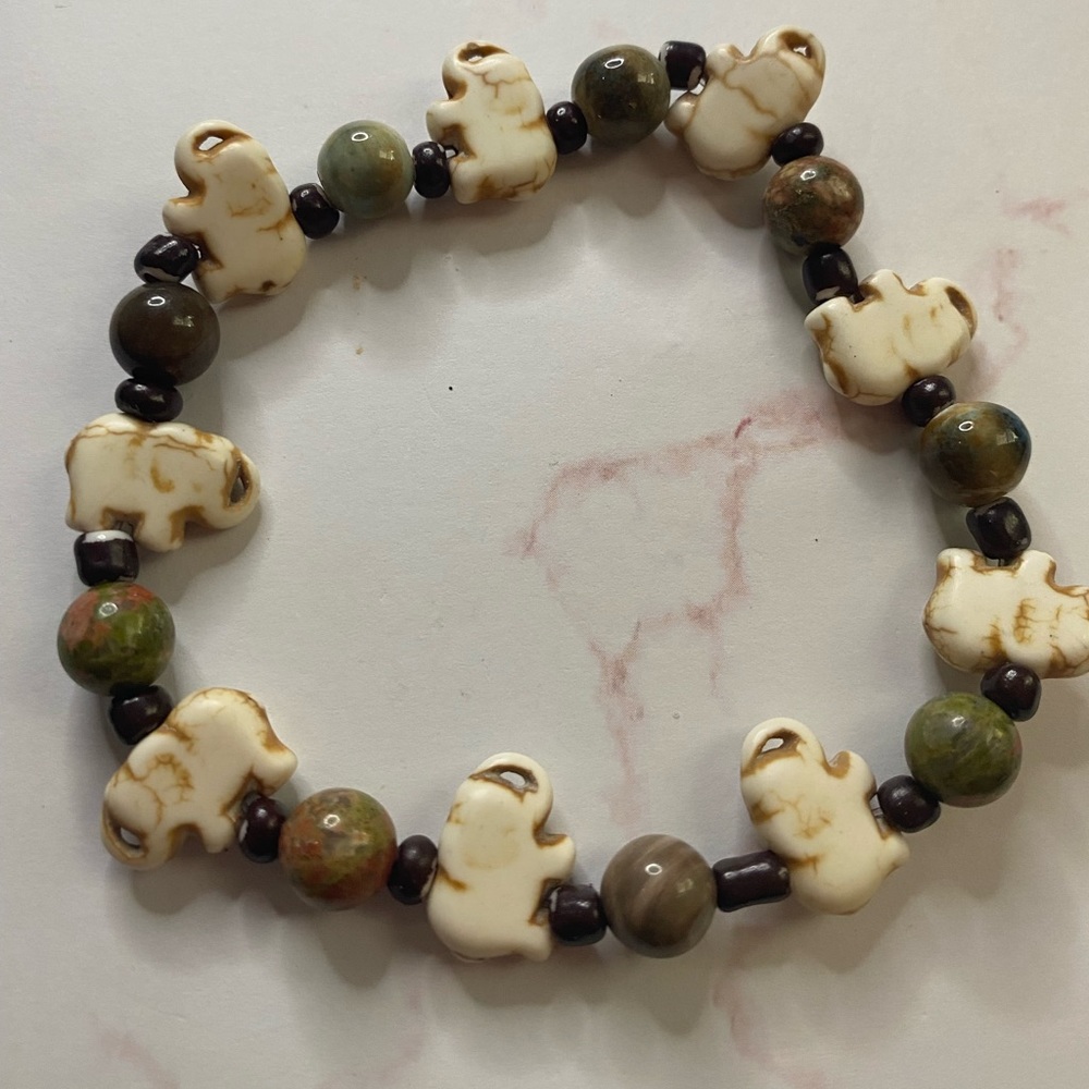 Elephant with greenish stones